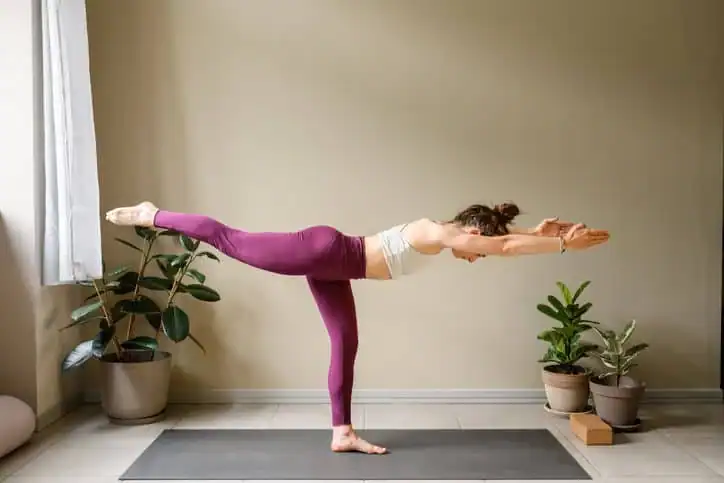 Achieving the Perfect Tone: How Often Should You Exercise for Results? 1 Woman doing Yoga exercise Coventry to help with toning the body.